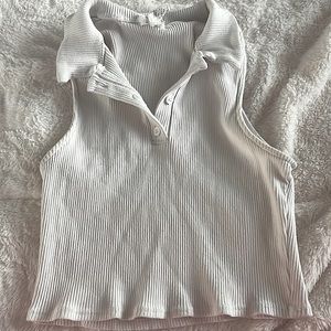 hello, i’m selling a cute cropped no sleeve button up tee! perfect for summer!